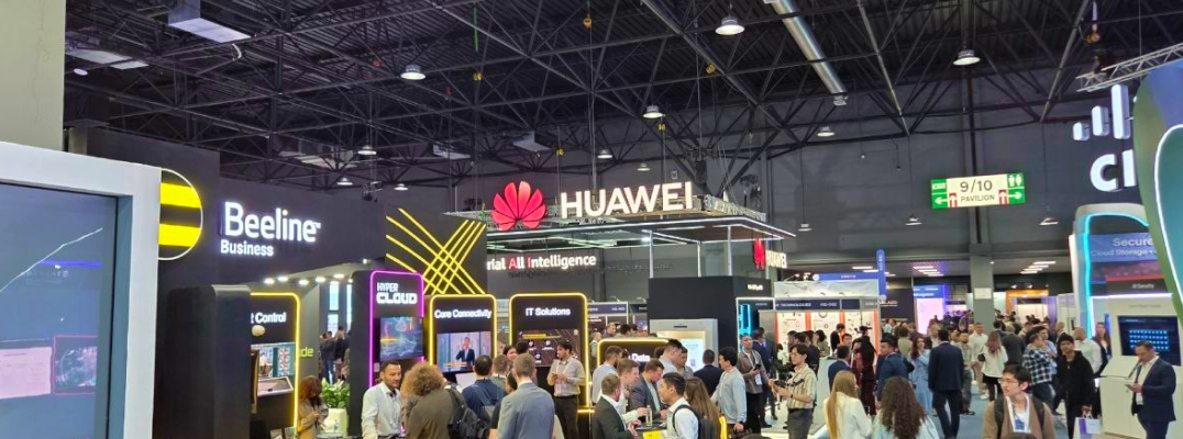 Exhibition hall crowds visit tech booths at GITEX AI Central Asia